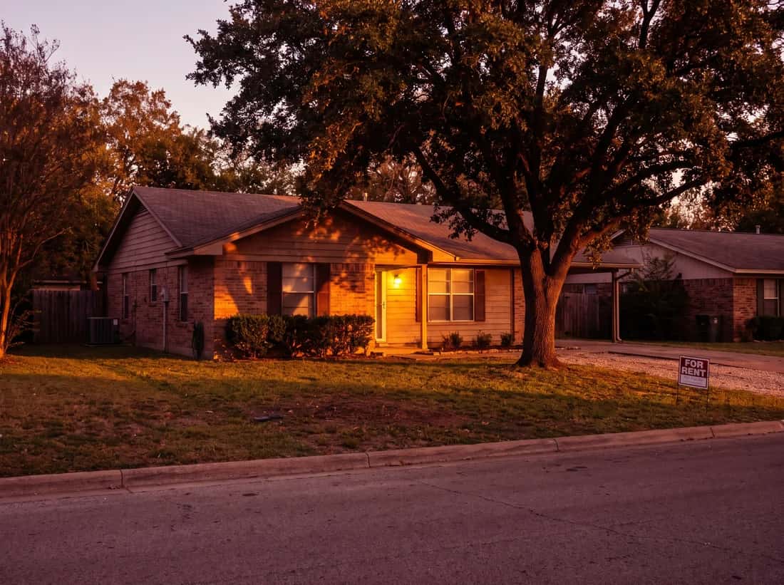 A single family rental house from the street at golden hour.