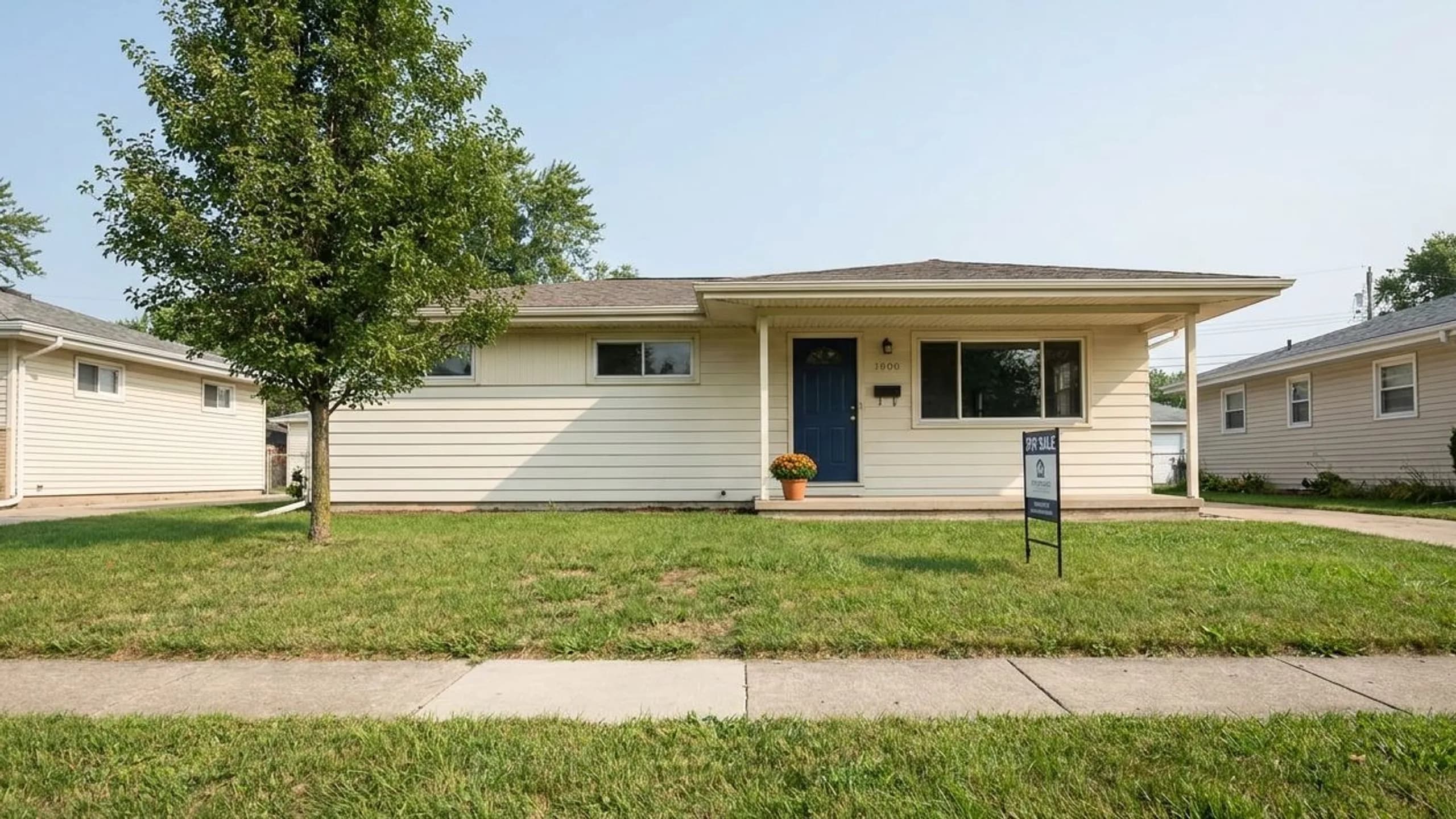 Modest single-family home exterior representing a house flipping vs buy and purchase